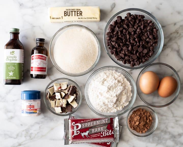These Peppermint Brownies are rich, chocolatey and easy to make from scratch. They have a gorgeous crinkly top with a gooey middle, and a chocolate & peppermint ganache. Christmas brownies make a great addition to any holiday cookie tray! overhead photo of the ingredients in this Peppermint Brownie recipe