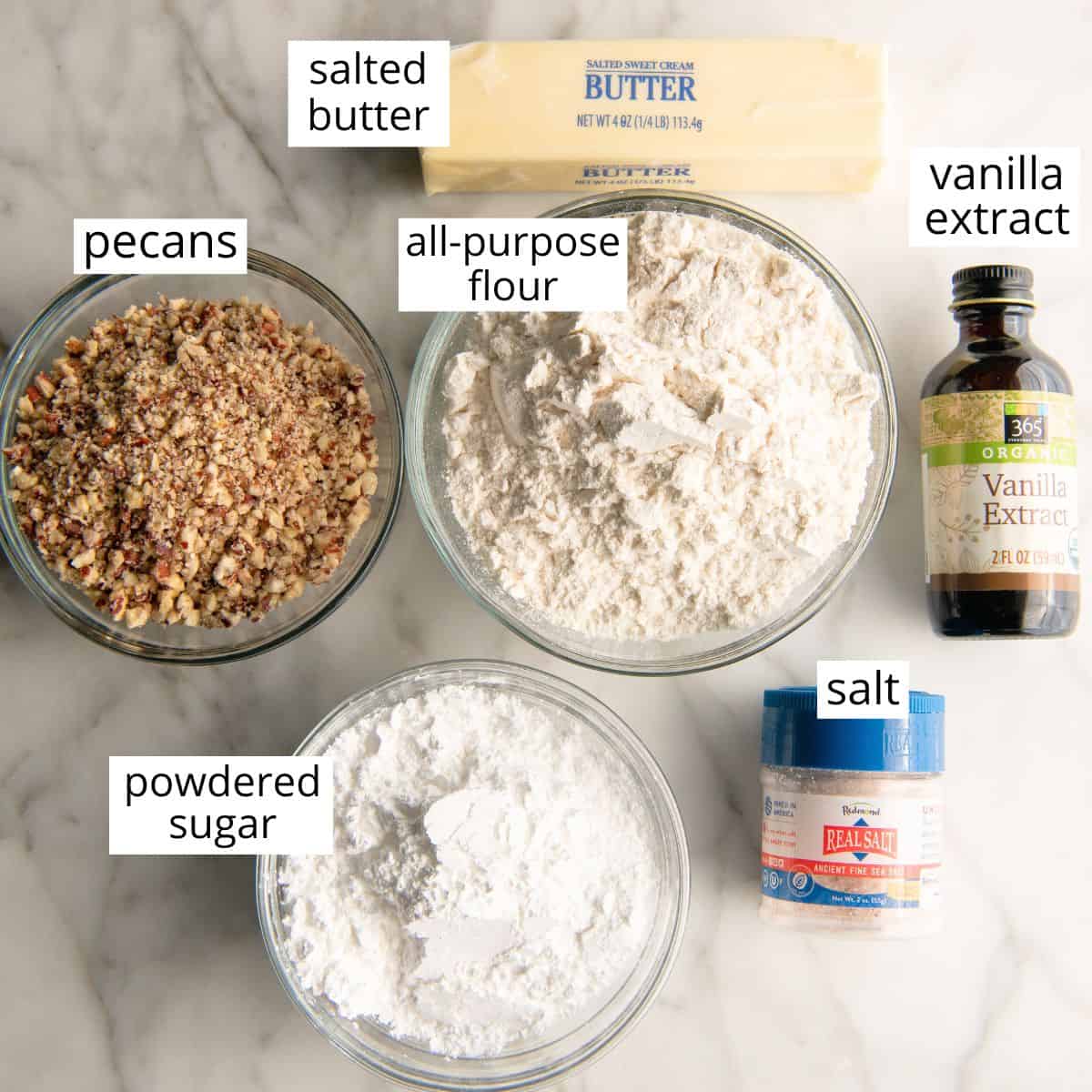 overhead view of the labeled ingredients in this snowball cookie recipe
