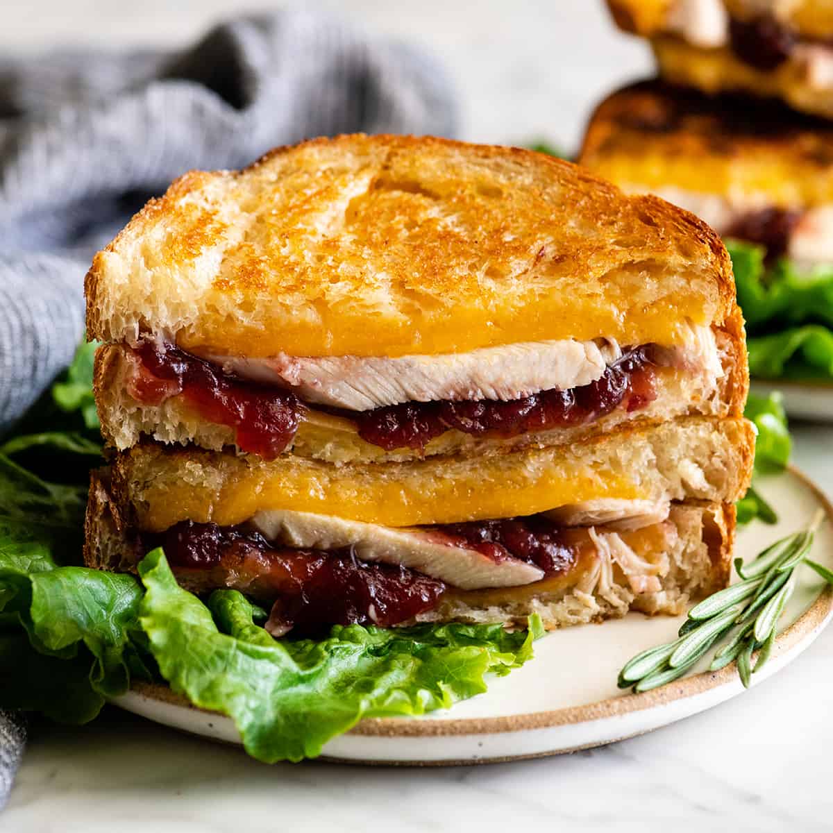 front view of two halves of a Turkey Cranberry Sandwich stacked on each other