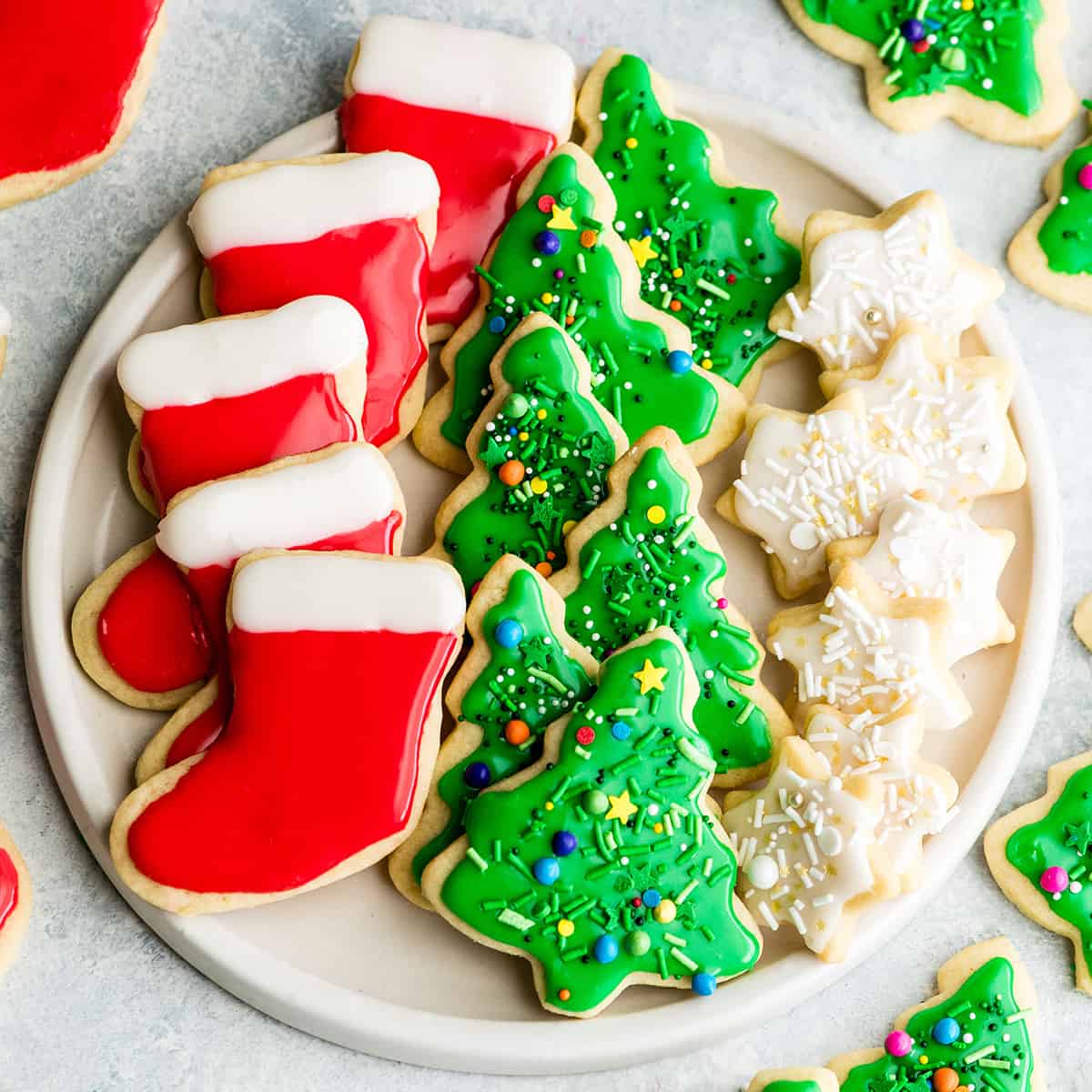 a plate of best christmas cookie recipes - cut out sugar cookies