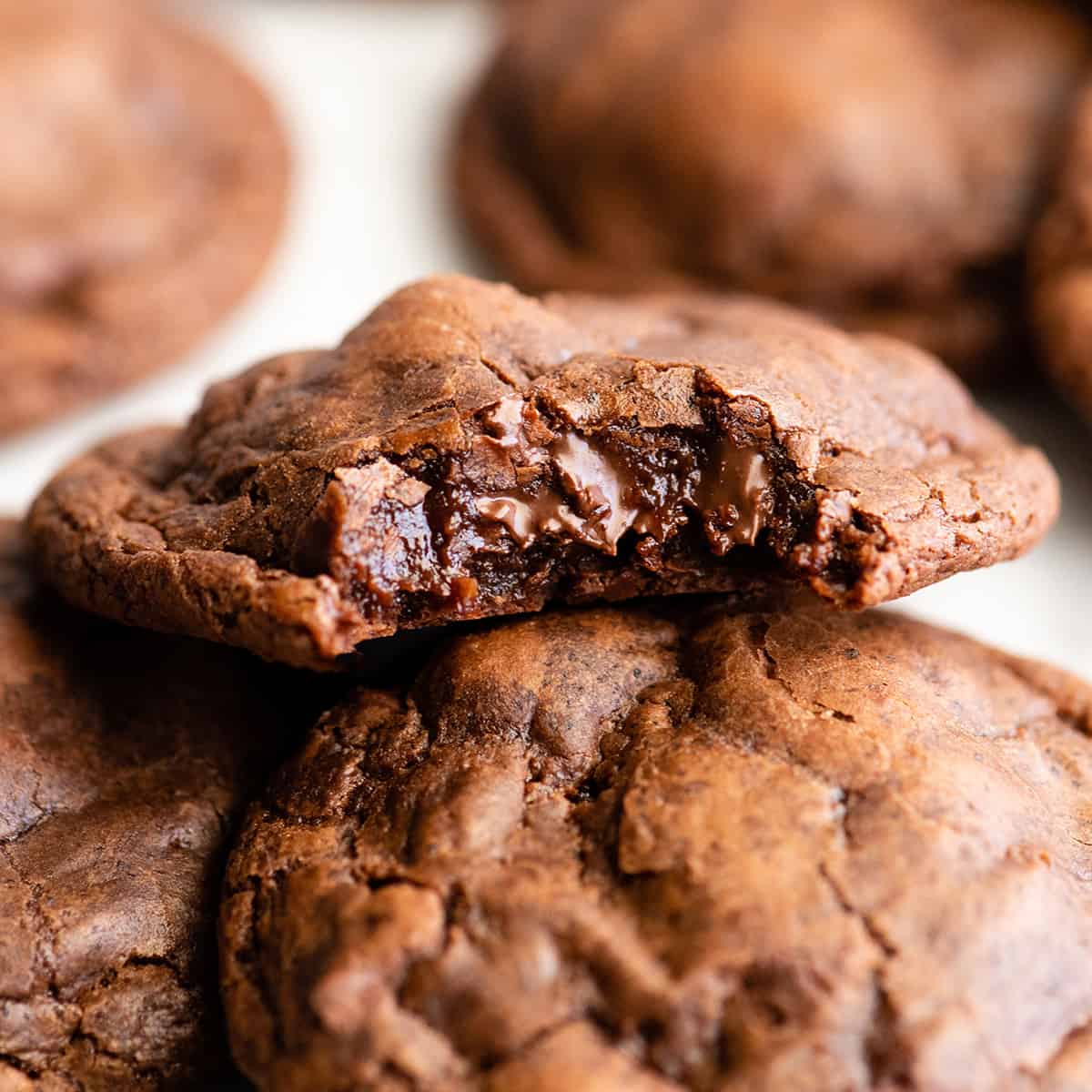front view of Chocolate Brownie Cookies, one with a bite taken out of it