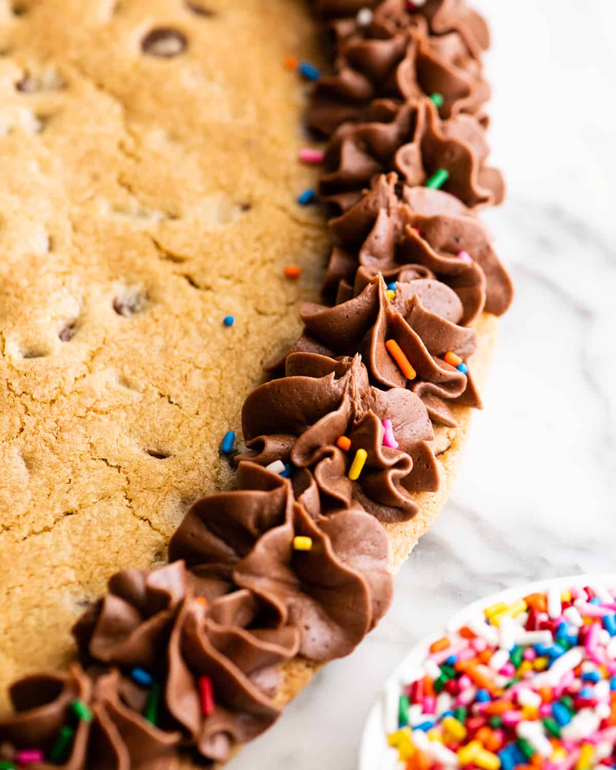 overhead view of chocolate frosting on a Chocolate Chip Cookie Cake