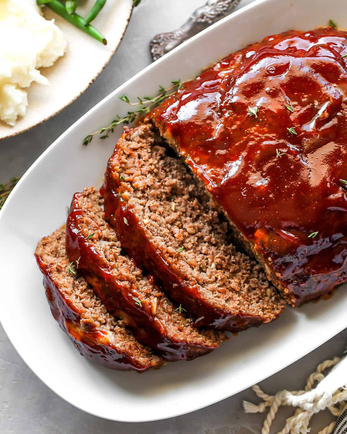 overhead view of the best meatloaf cut into slices on a serving platter