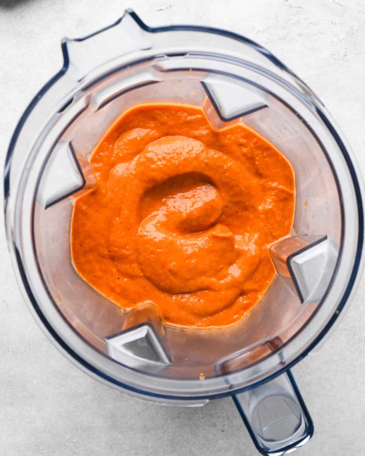 tomato puree after blending in a container of a blender 