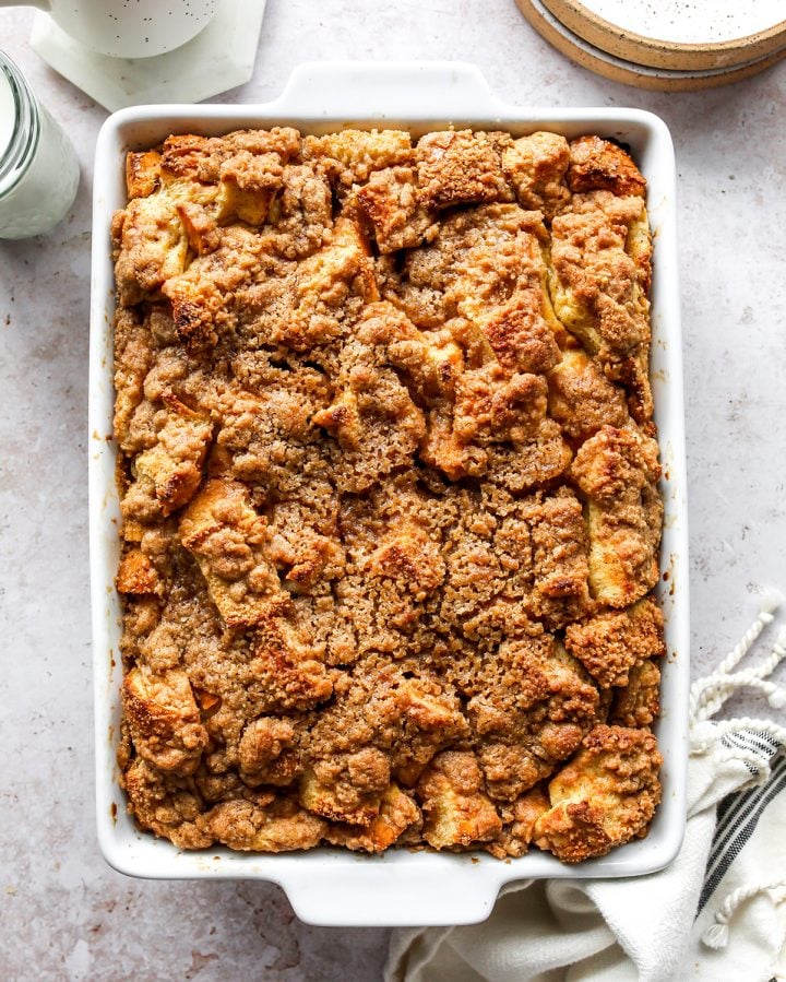 The best Baked French Toast Casserole recipe is an easy & delicious breakfast. French bread is combined with a sweet vanilla egg & milk mixture and topped with a buttery streusel topping. This overnight French toast casserole is made at night and baked in the morning so it's easy to prepare and enjoy! Overnight Baked French Toast Casserole in a baking dish