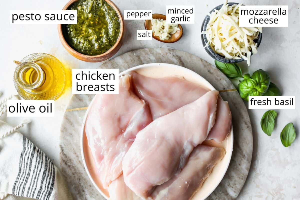 overhead photo of the labeled ingredients in this pesto chicken recipe. 