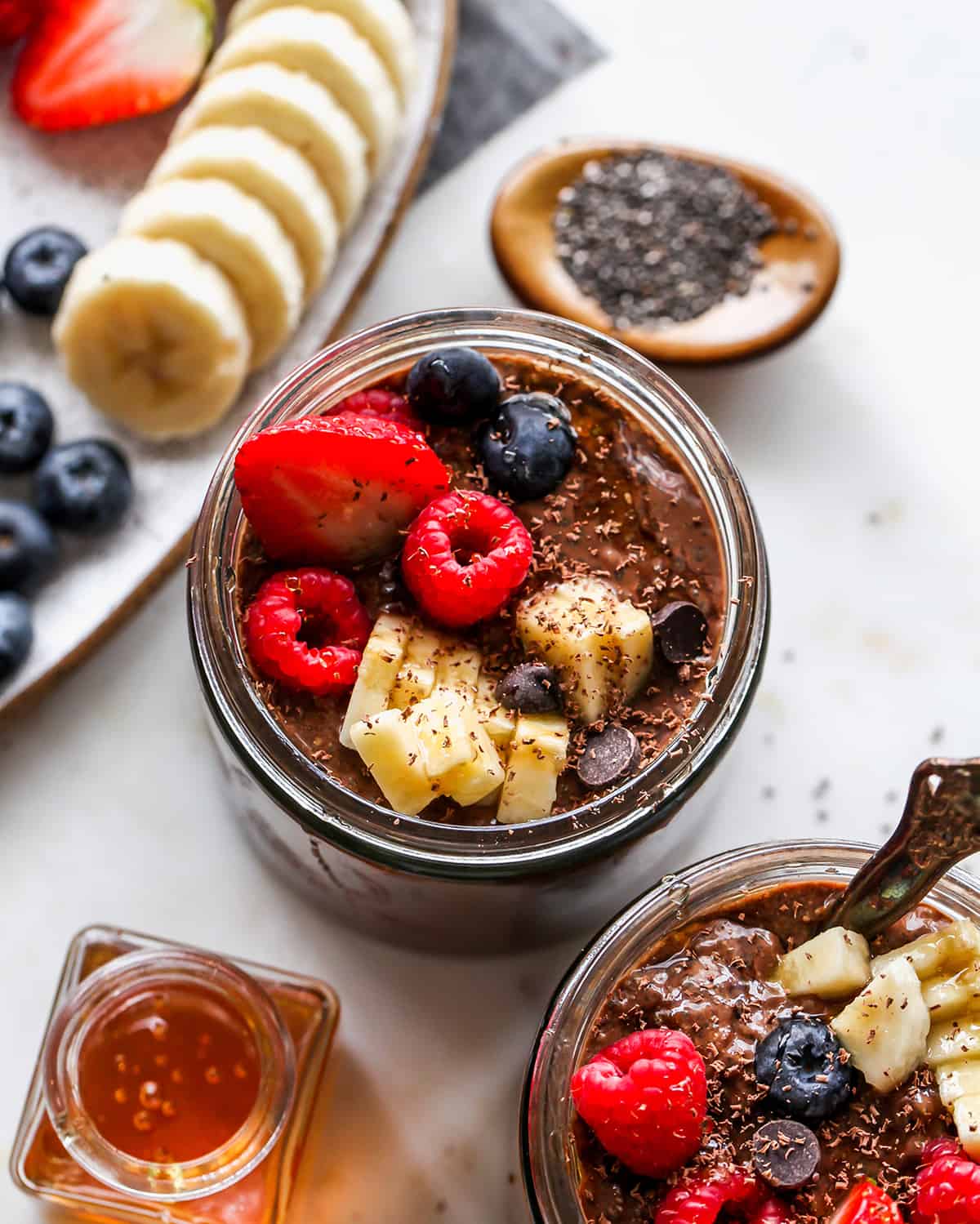 Chocolate Chia Pudding in a jar with fruit on top
