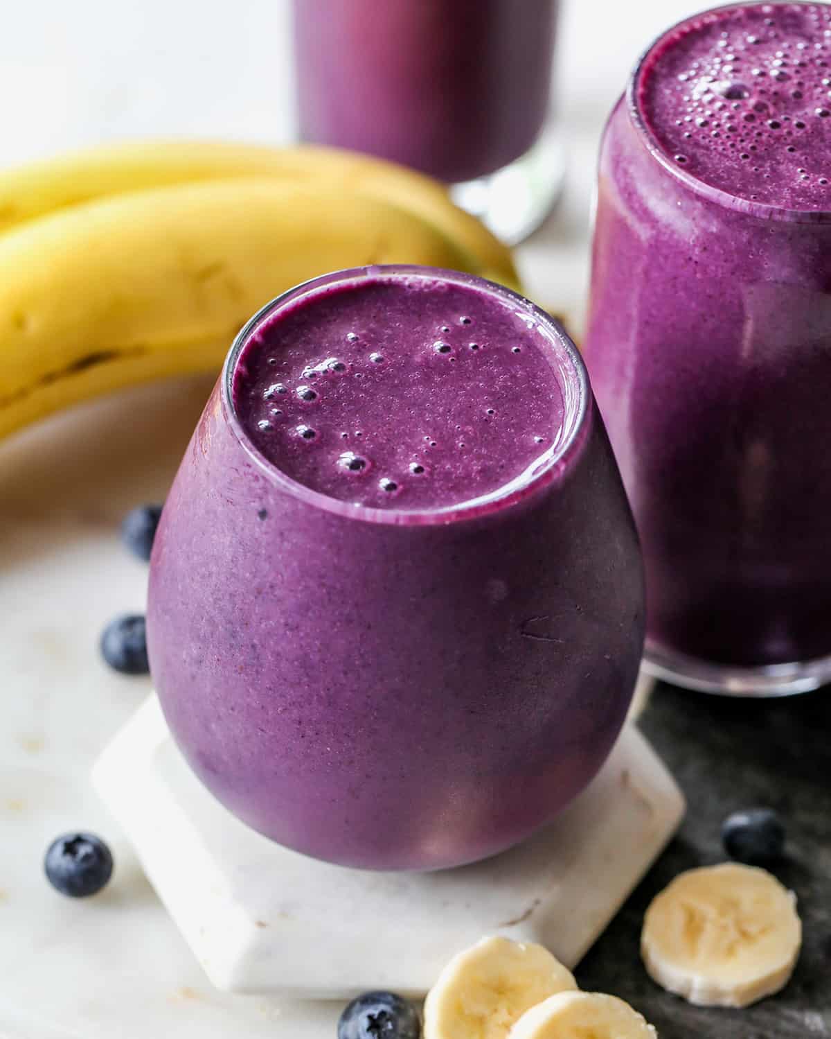 three glasses filled with Blueberry Smoothie