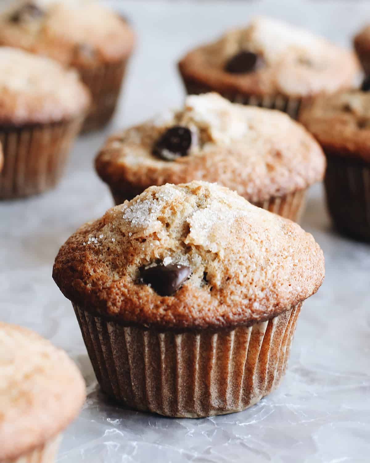 front view of 6 Banana Chocolate Chip Muffins in muffin liners