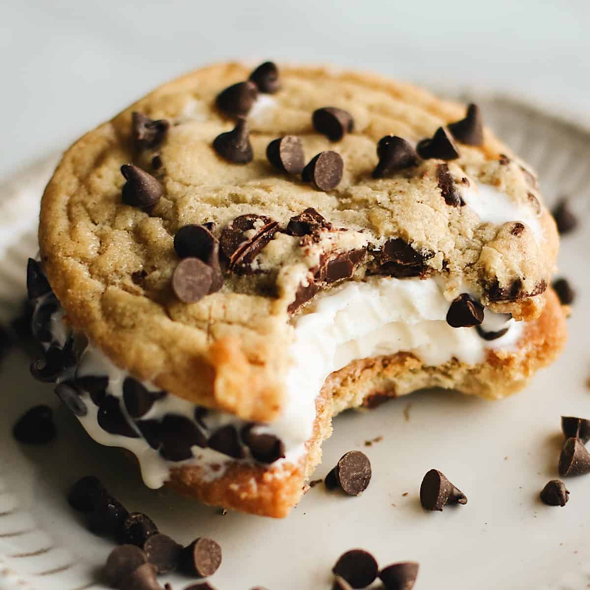 1 cookie ice cream sandwich with a bite taken out of it