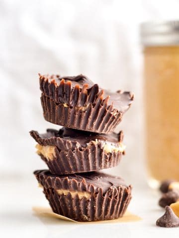 Front view of three Healthy Homemade Peanut Butter Cups stacked on top of each other.