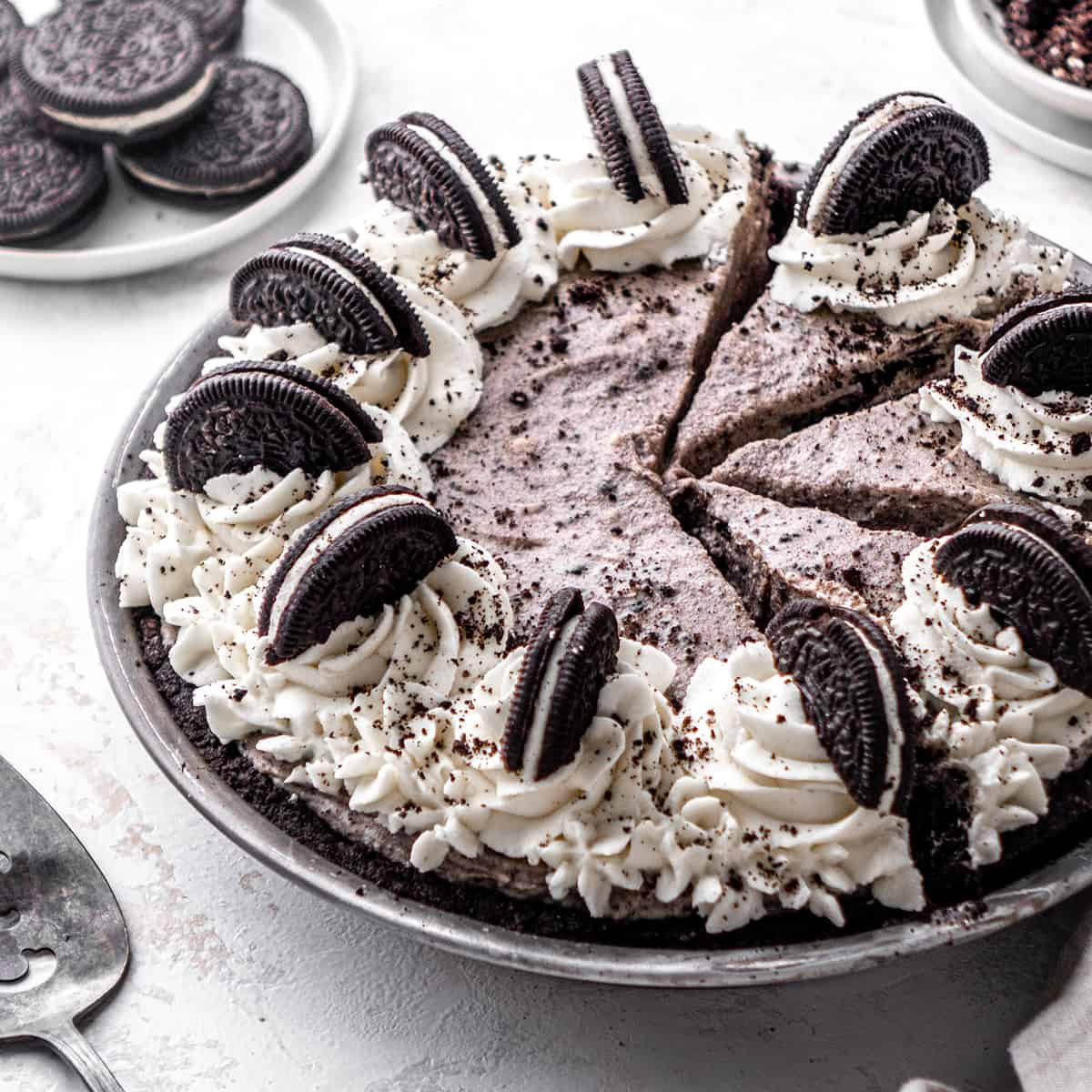 front view of an Oreo Pie decorated with whipped cream and Oreo cookies