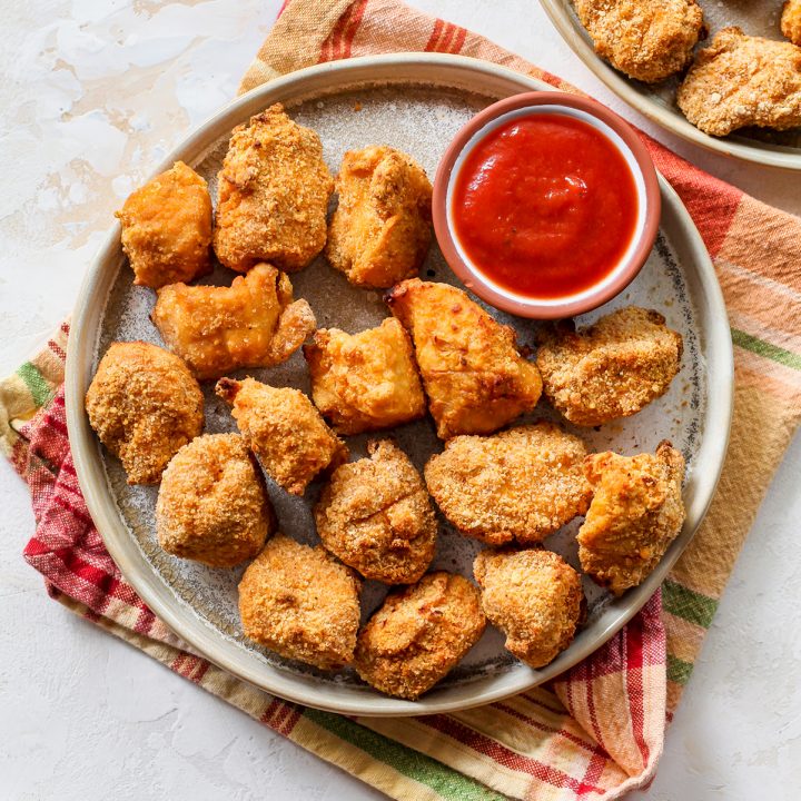 overhead view of Homemade Chicken Nuggets on a plate with a small bowl of ketchup