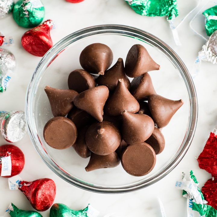 unwrapped Hershey kisses in a bowl to put in the freezer to make this Hershey kiss cookies recipe