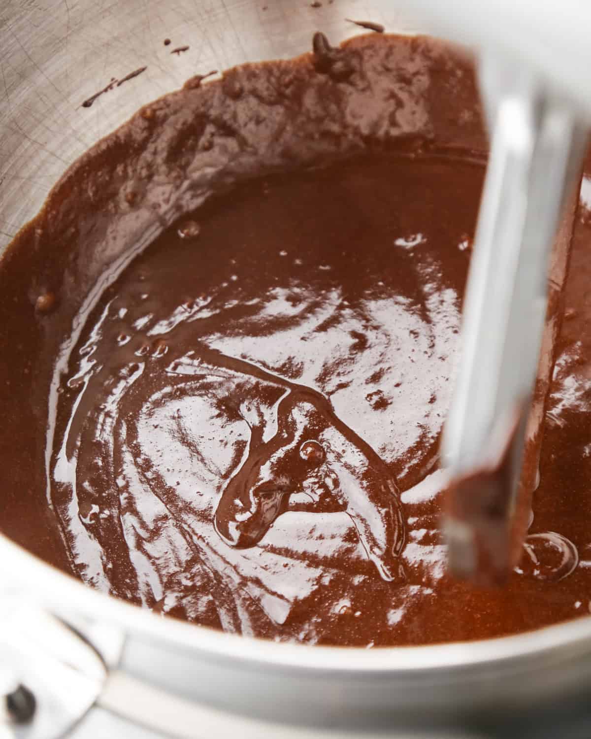 pumpkin brownies batter in a metal mixing bowl 