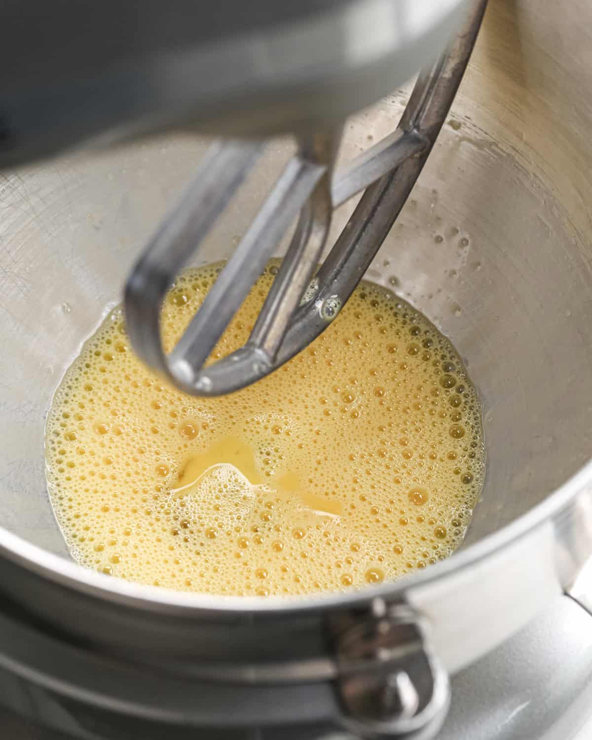 making pumpkin brownies - beaten eggs in a metal standing mixer bowl fitted with the paddle attachement