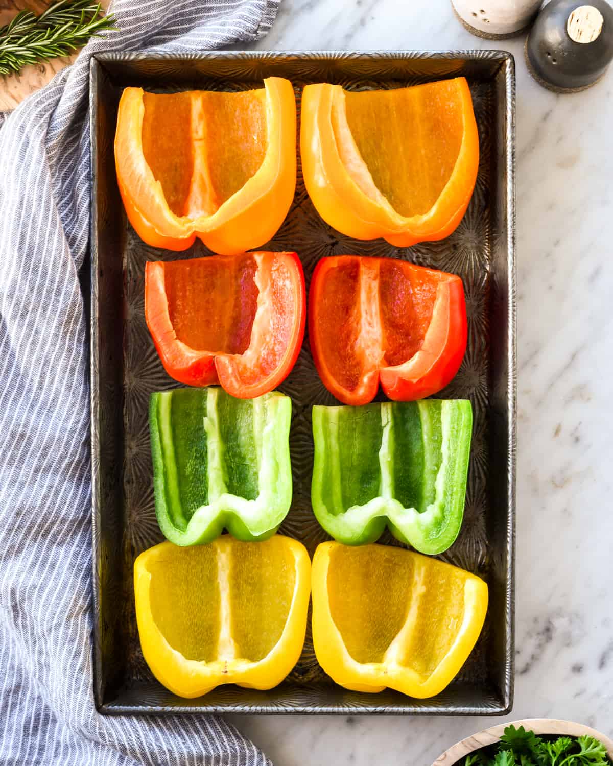 overhead view of peppers being cooked in this Italian Stuffed Peppers recipe