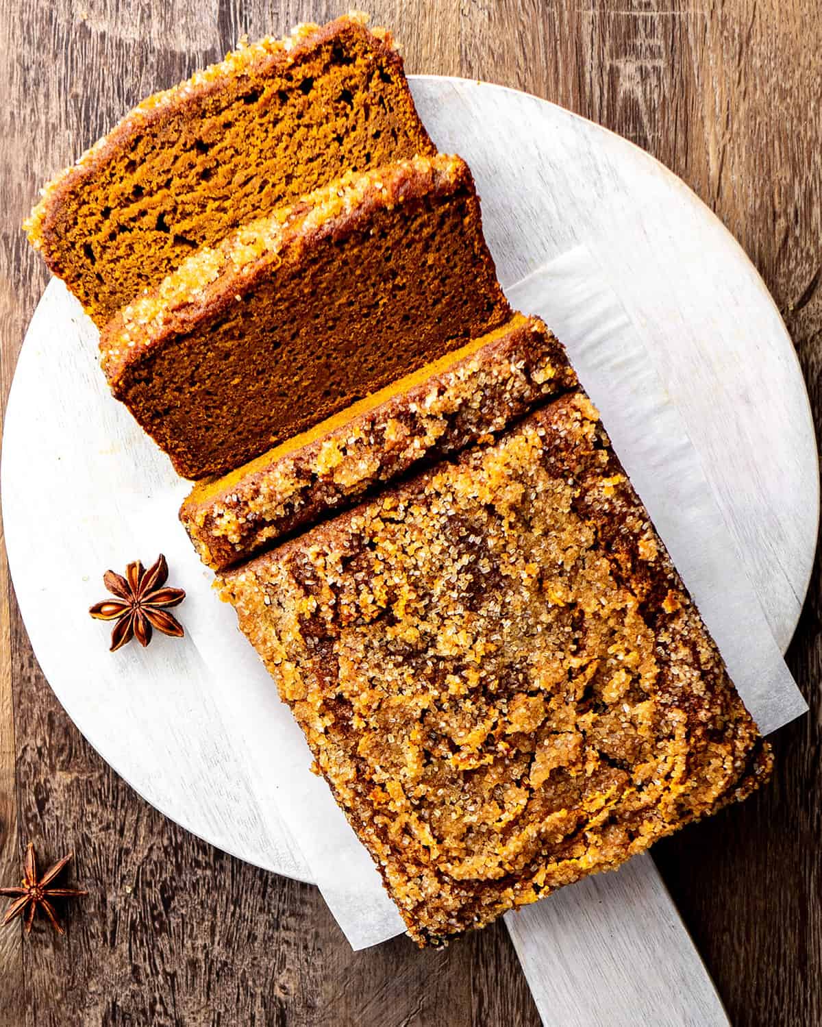 a loaf of Healthy Pumpkin Bread with 3 slices cut out of it
