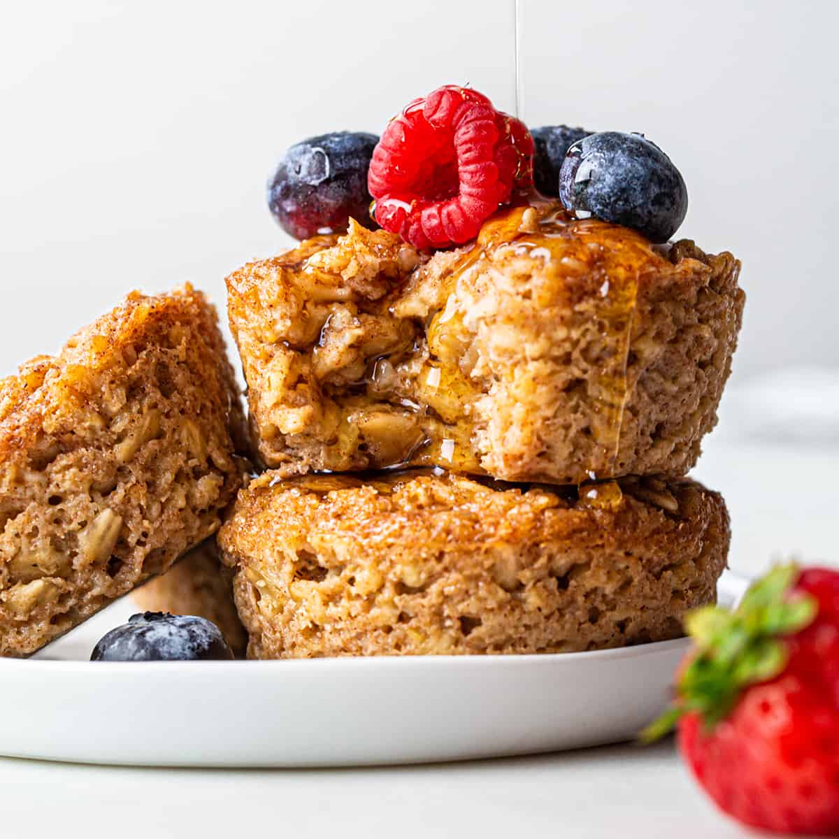 3 Baked Oatmeal Cups with berries and maple syrup