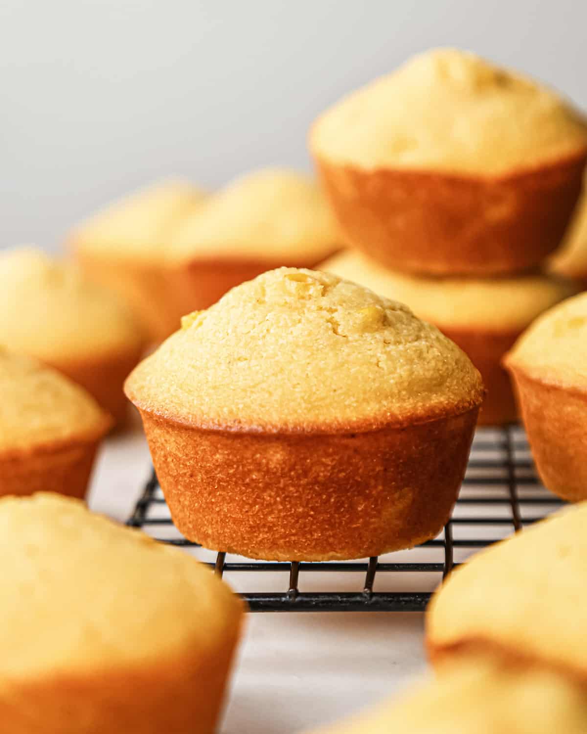 Cornbread Muffins cooling on a wire cooling rack