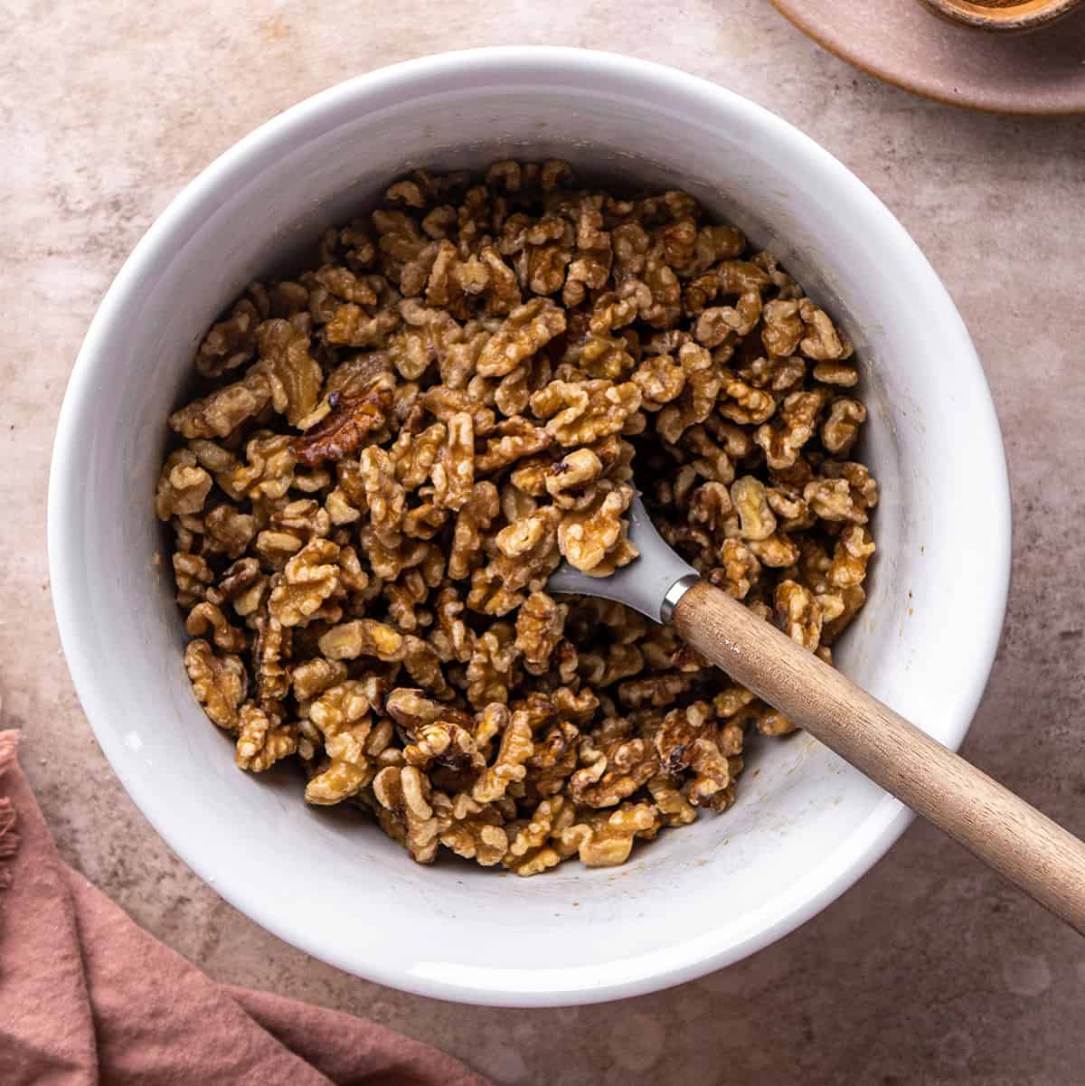 how to make candied walnuts - coating walnuts with egg white mixture