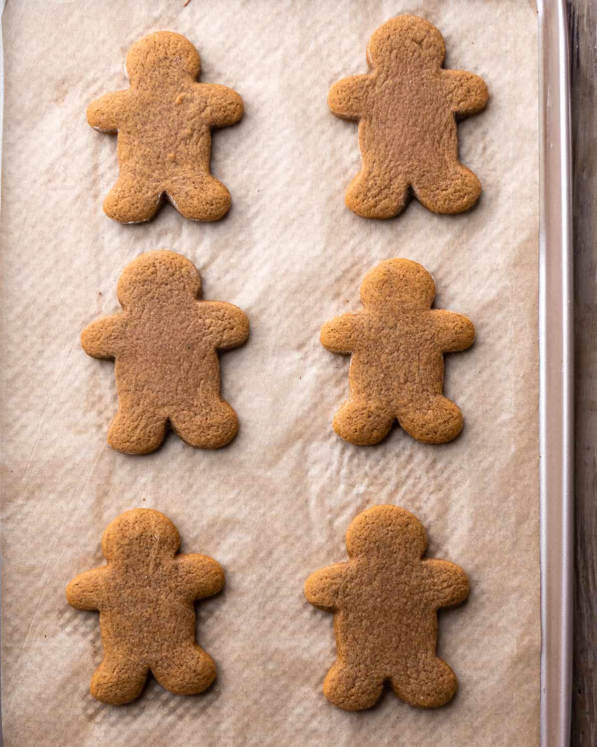 How to Make Gingerbread Men - cut out gingerbread men on a baking sheet before baking
