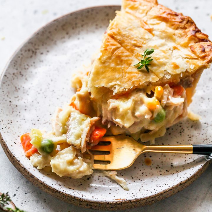 a piece of Leftover Turkey Pot Pie on a plate with a fork