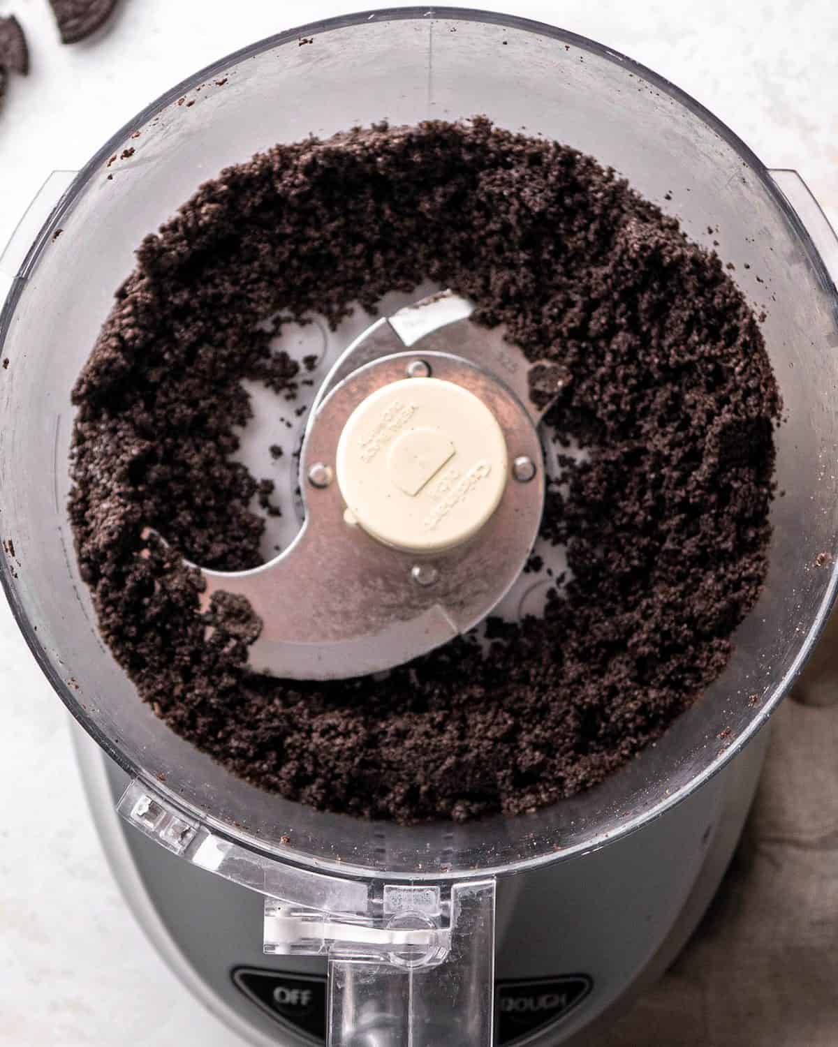 making Oreo pie recipe - Oreo cookie crumbs from 8 cookies in a food processor fitted with the "S" blade
