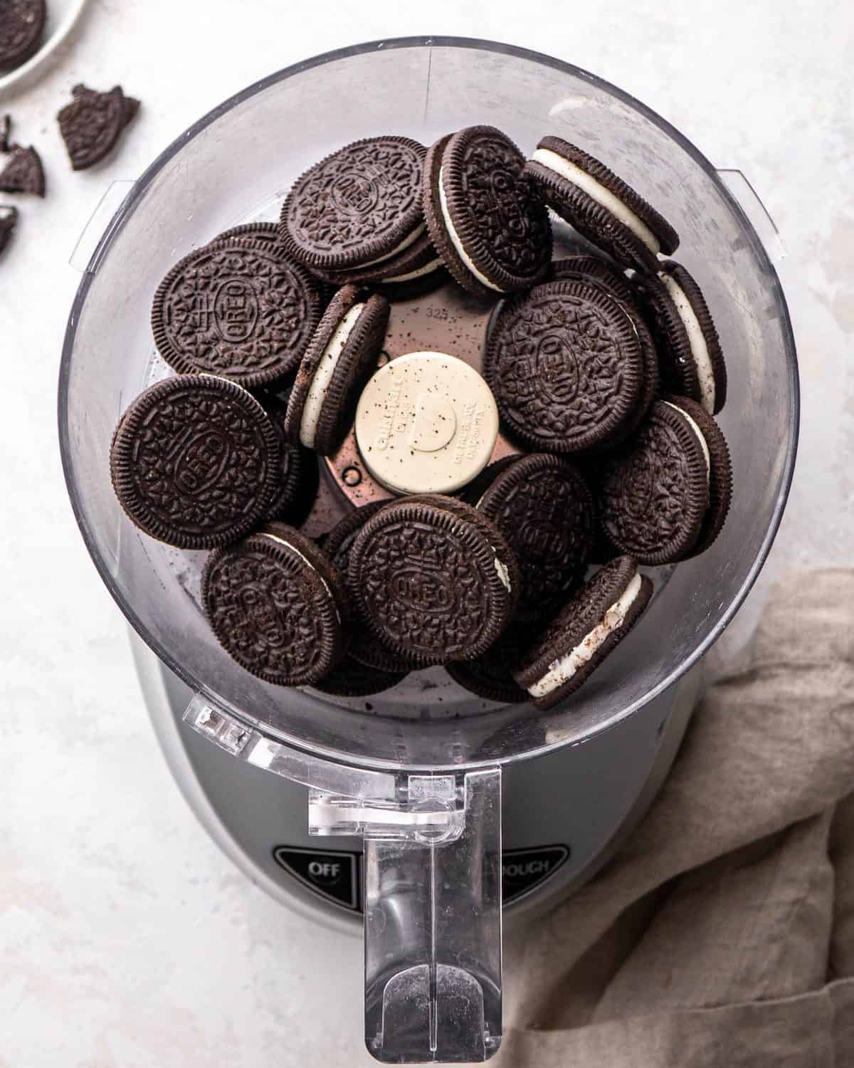 making oreo pie recipe - whole oreos in a food processor fitted with the "S" blade