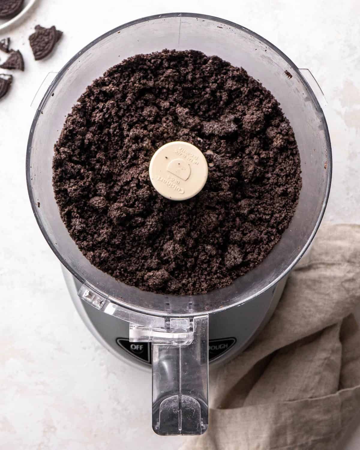 making oreo pie recipe - oreo crumbs in a food processor fitted with the "S" blade