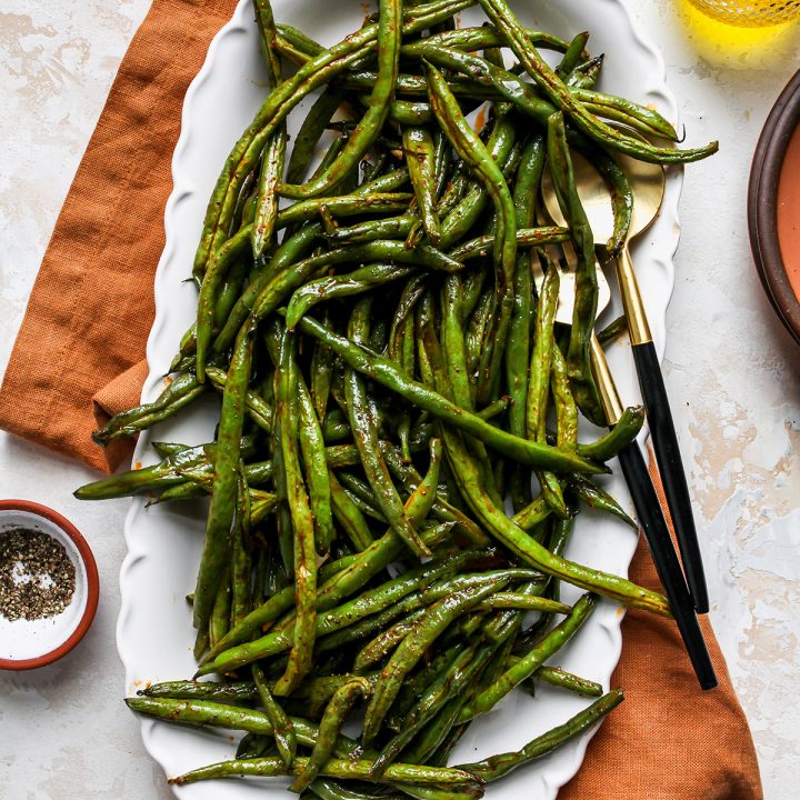 Oven Roasted Green Beans on a white serving dish
