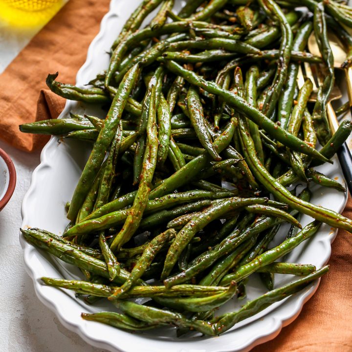 Oven Roasted Green Beans on a white serving dish