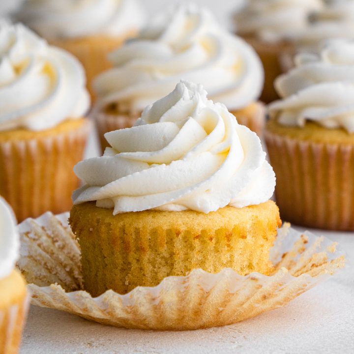 4 Vanilla Cupcakes topped with white frosting