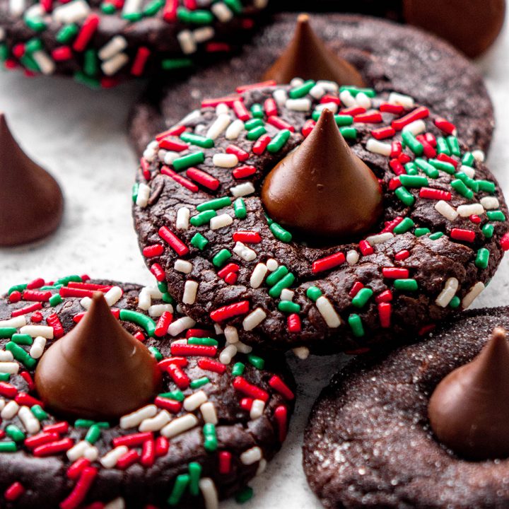 5 Chocolate Kiss Cookies, some rolled in Christmas sprinkles, some rolled in sugar