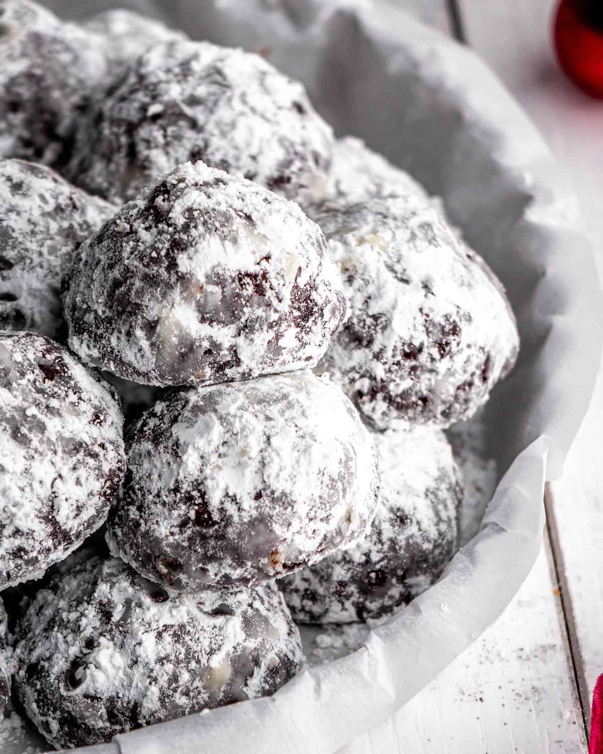9 Chocolate Snowball Cookies on a serving plate