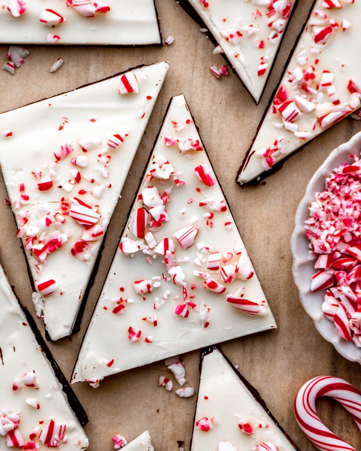 two pieces of Peppermint Bark  cut into triangles with other pieces around them