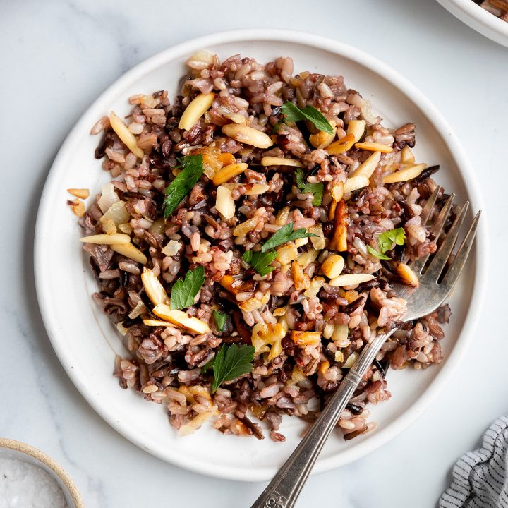 a plate of Almond Wild Rice garnished with fresh parsley
