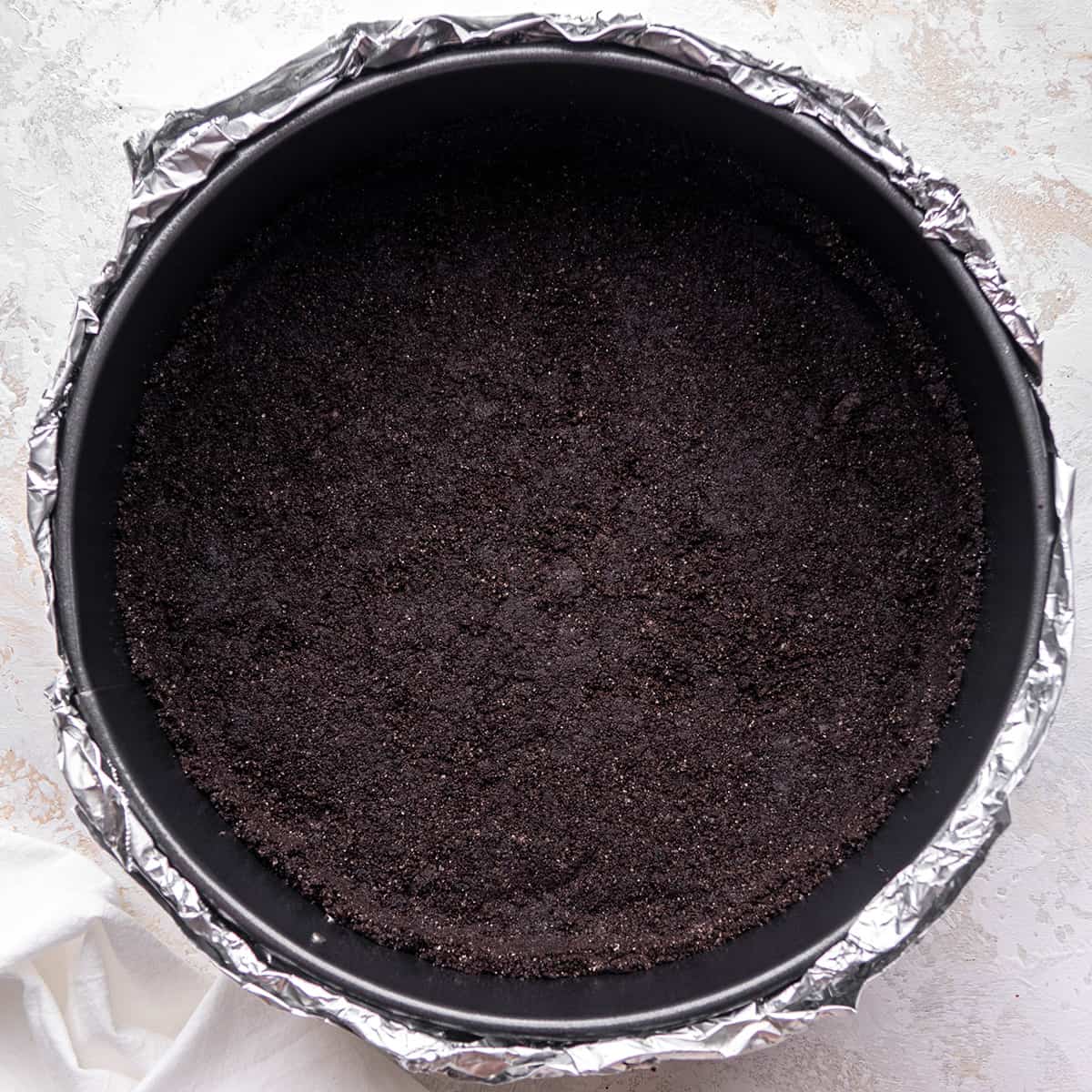 two photos showing How to Make Chocolate Cheesecake - Oreo crust after baking 