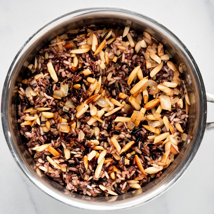 How to Make Wild Rice - mixing rice and onion/almond mixture