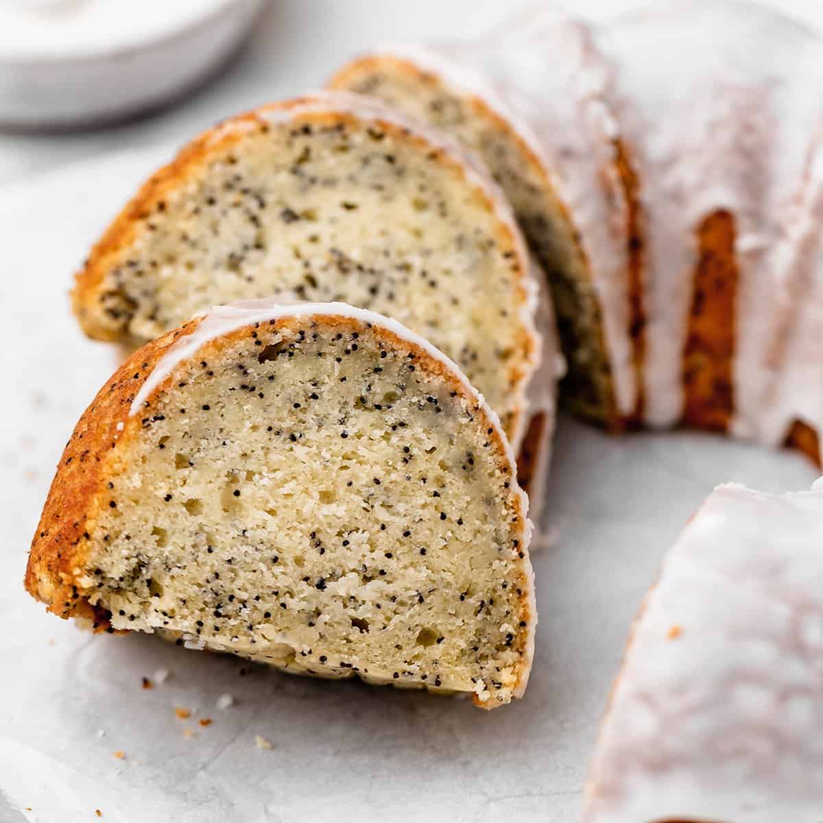 Lemon Poppy Seed Cake with 2 slices cut out of it