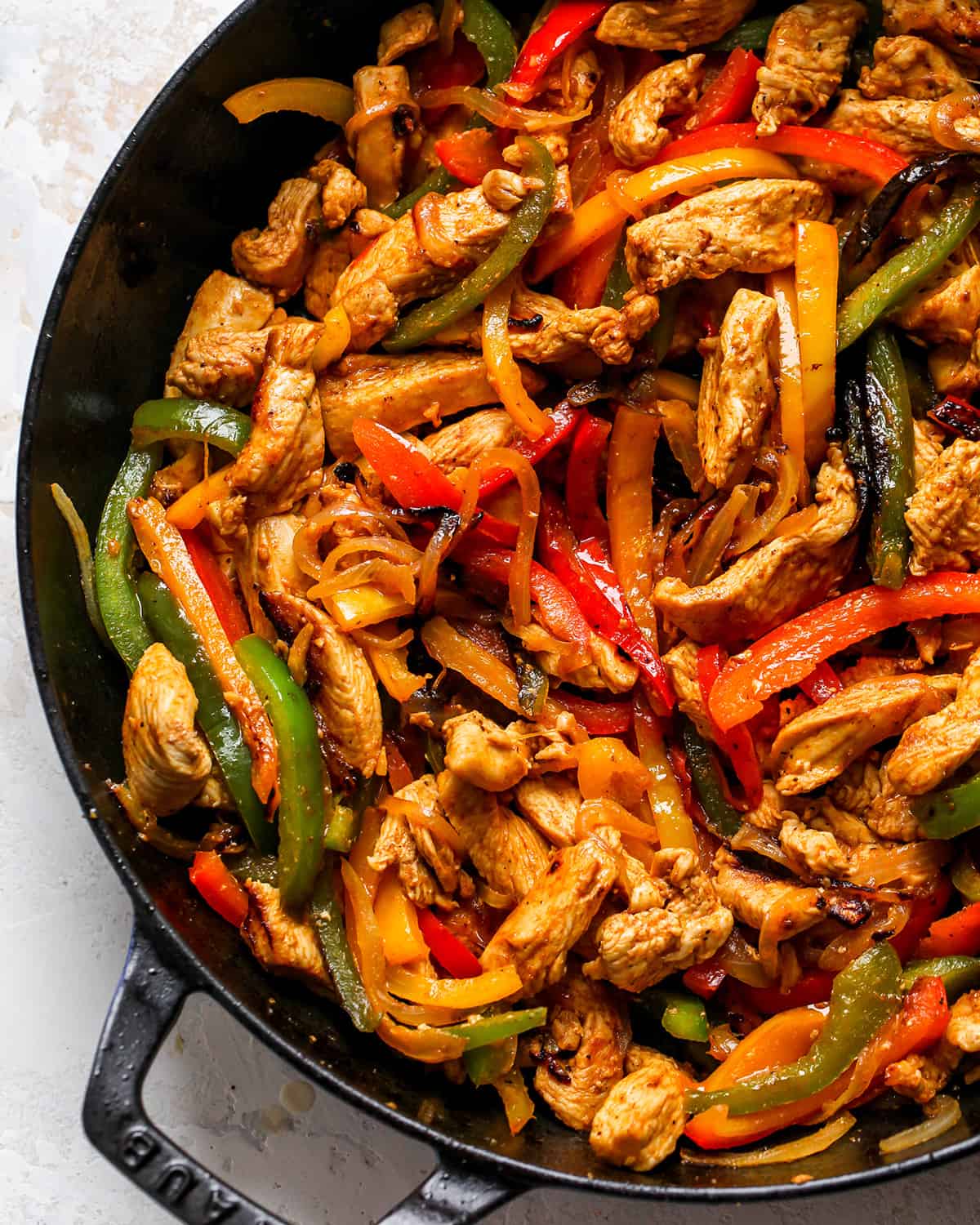 cooked Chicken Fajitas in a cast iron skillet