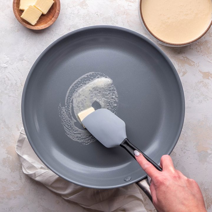 photo showing How to Make Crepes - melting butter in a crepe pan