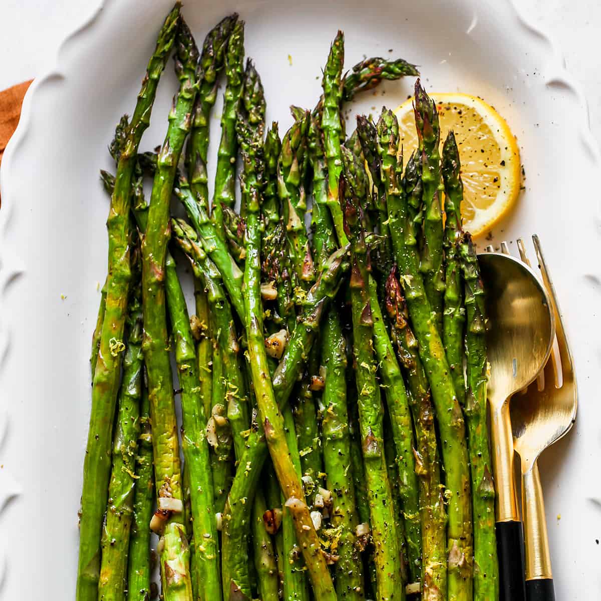 Oven Roasted Asparagus on a white serving dish