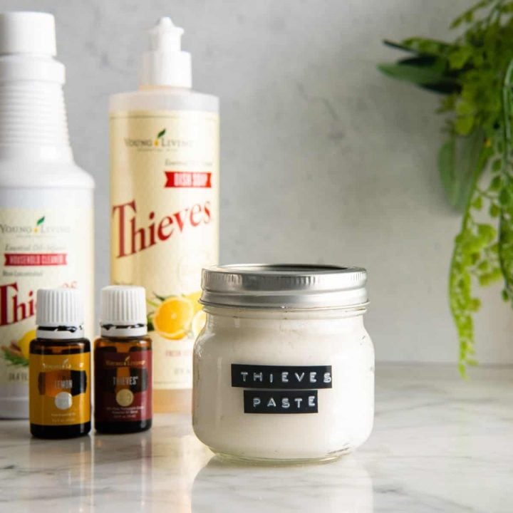 Thieves Cleaning Paste in a jar with a label and the ingredients near it