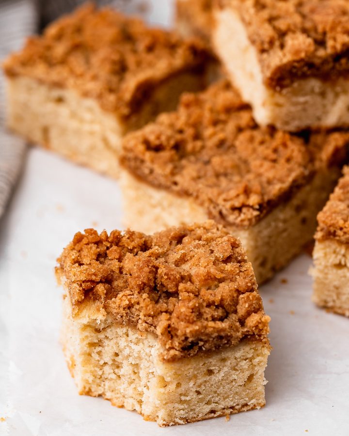 5 pieces of Cinnamon Coffee Cake, one with a bite taken out of it