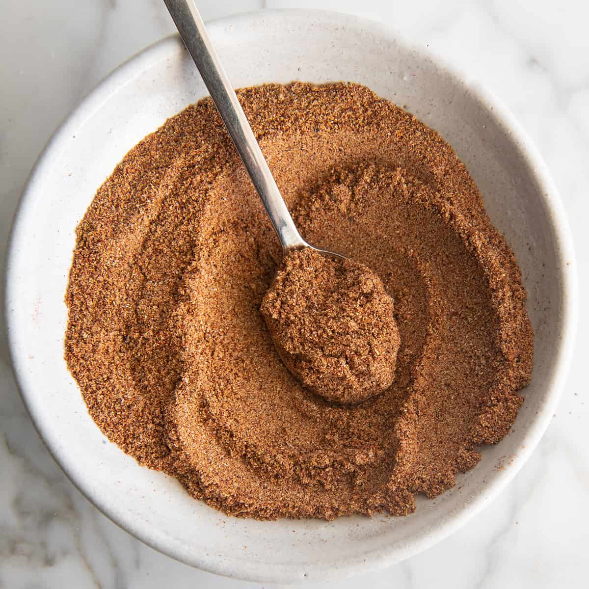 a bowl of Homemade Taco Seasoning with a spoon in it