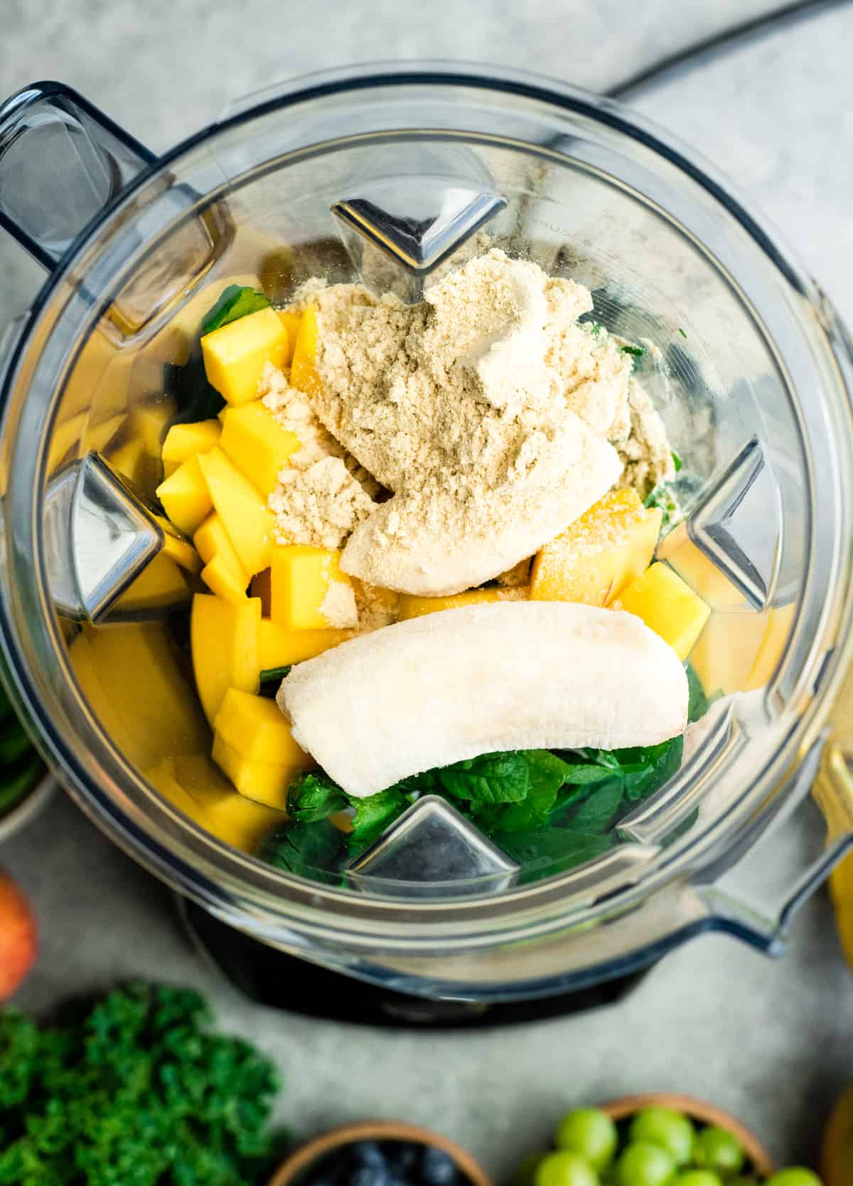 How to Make A Smoothie - overhead view of ingredients in a blending container 