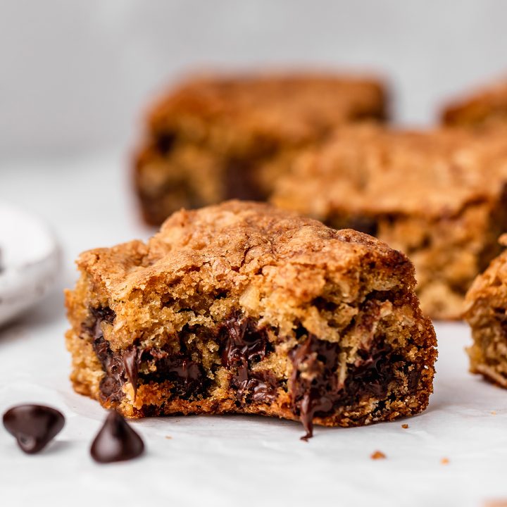 a Chocolate Chip Oatmeal Cookie Bar with a bite taken out of it