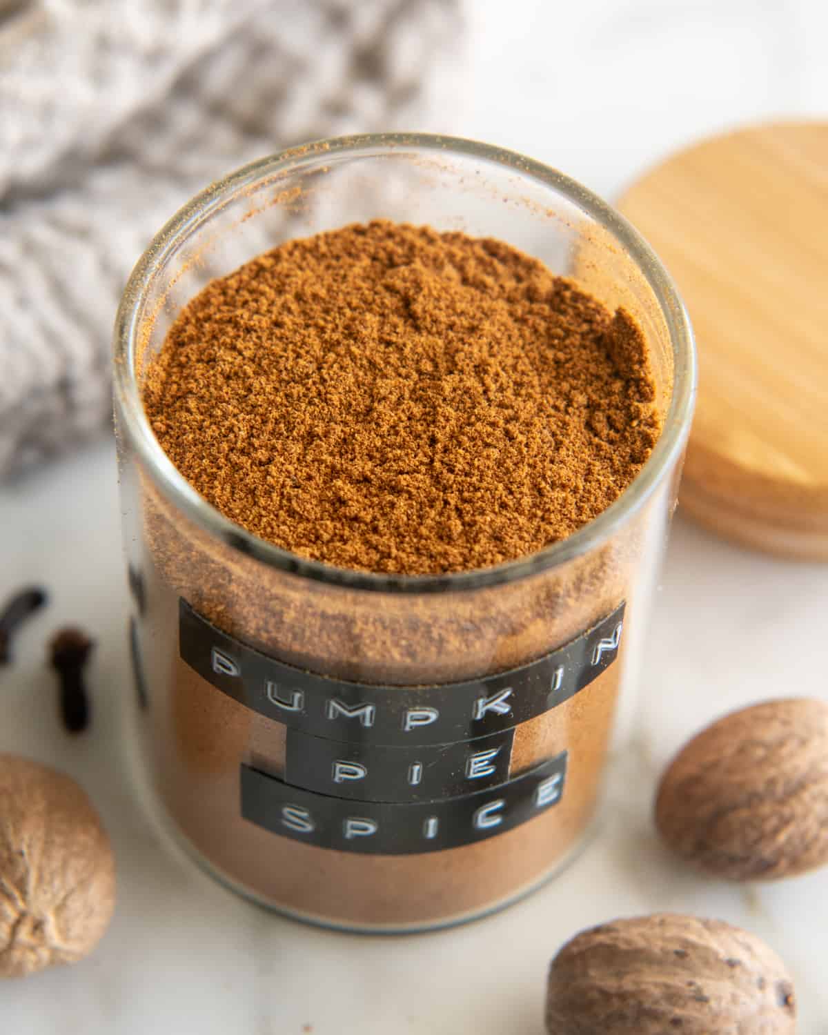 a jar of Homemade Pumpkin Pie Spice Recipe with the lid off