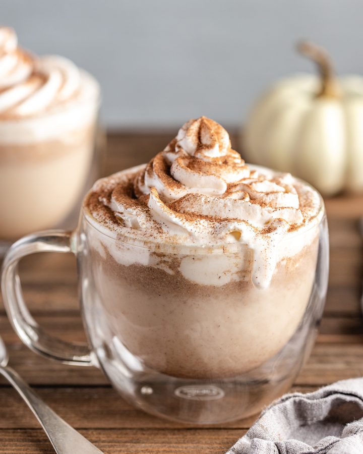 Homemade Pumpkin Spice Latte in a mug with whipped cream and cinnamon 